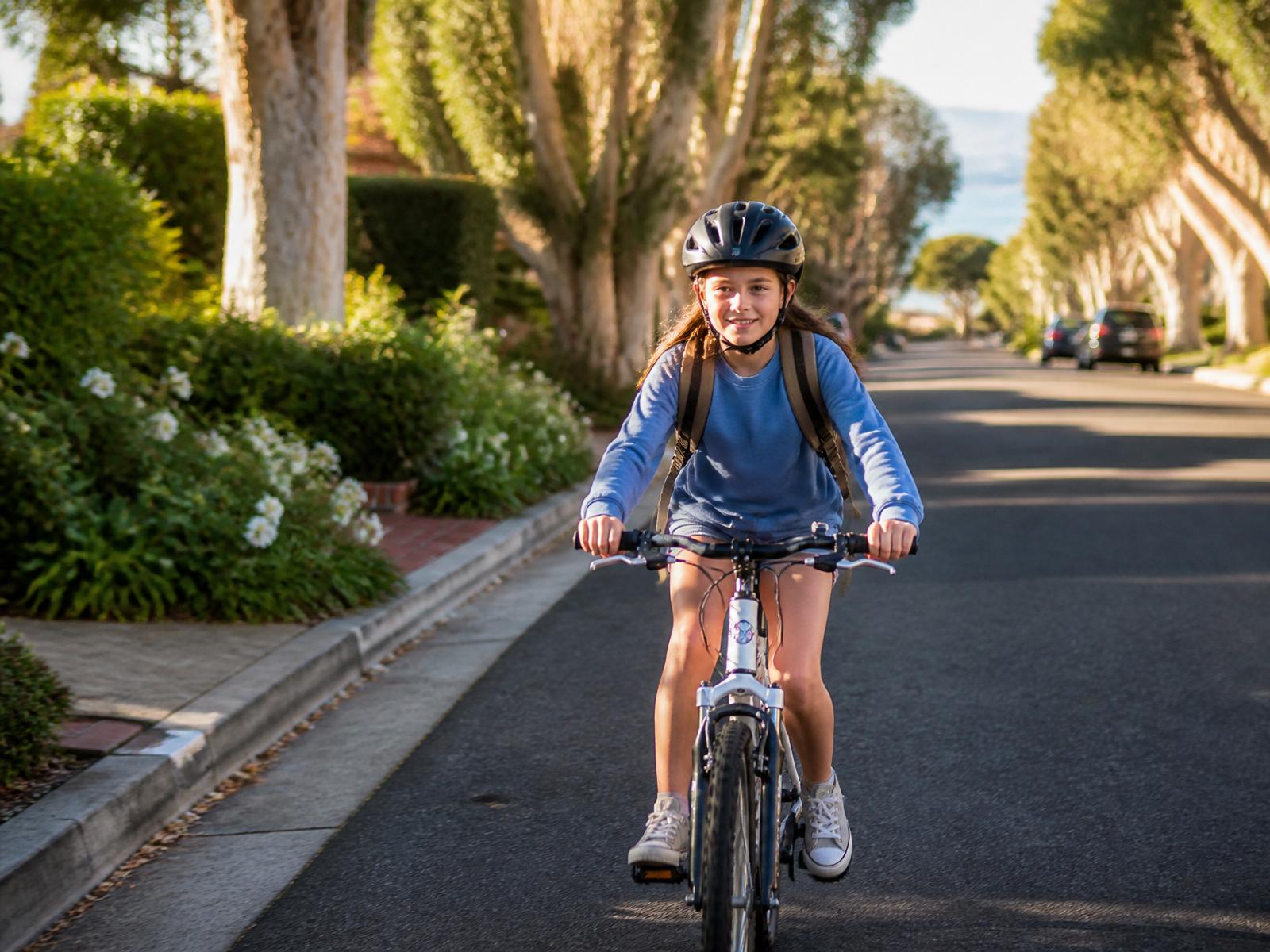 A young rider on a traditional pedal bicycle