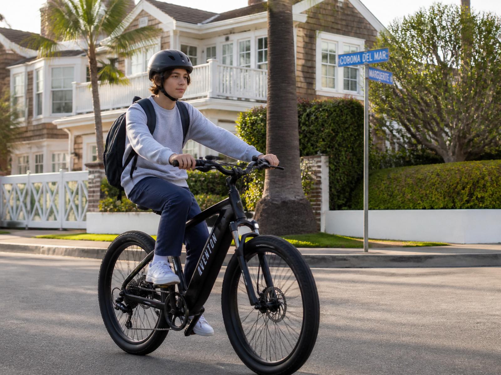 A teenage rider on an e-bike